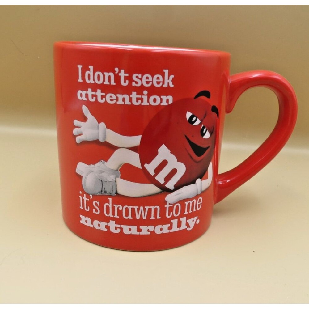 M & M's 2023Novelty Mug Red w/ words "I don't seek Attention..."